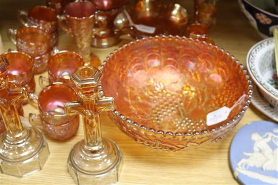 A pair of Carnival glass crucifix candlesticks and a collection of other marigold Carnival glass,